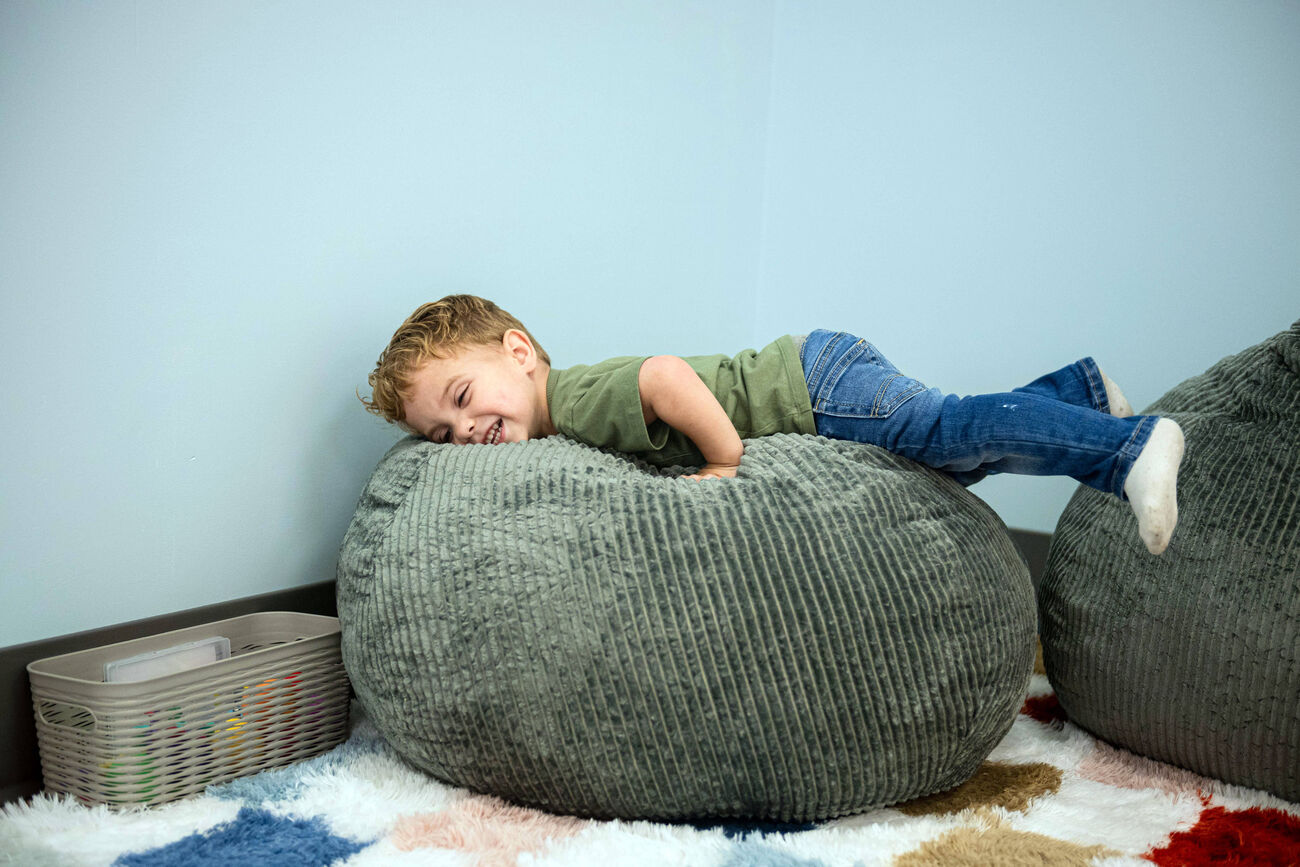 A child relaxing on a large bean bag