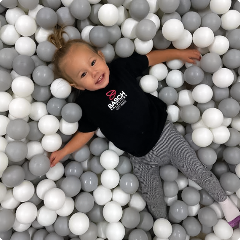 Child playing in ball pit