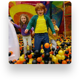 Child playing in ball pit